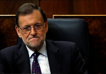 Spain’s acting Prime Minister and People’s Party leader Mariano Rajoy attends an investi