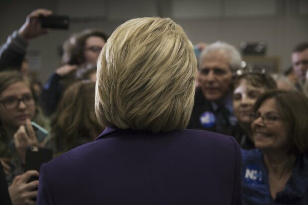 Hillary Clinton campaigning in New Hampshire presidential primary. Winnacunnet High School, Hampton, NH. Being interviewed by Joe Klein of TIME Magazine. by James Nachtwey
