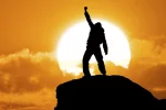Man on top of mountain