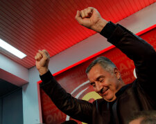 Montenegrin Prime Minister and leader of ruling Democratic Party of Socialist Milo Djukanovic celebr