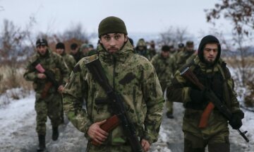 Pro-Russian separatists from the Chechen «Death» battalion walk during a training exercise