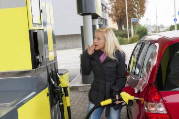 woman at refuel at petrol station