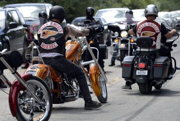Members of the Hells Angels ride outside the Hells Angels Nomads compound during the group's Canada Run event in Carlsbad Springs, Ont., near Ottawa, on Saturday, July 23, 2016. THE CANADIAN PRESS/Justin Tang
