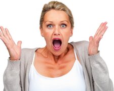 Surprised woman isolated against white background