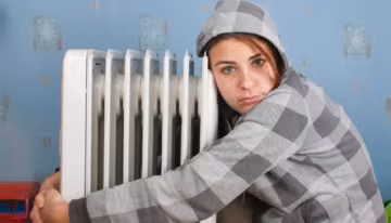 cold-girl-hugging-radiator