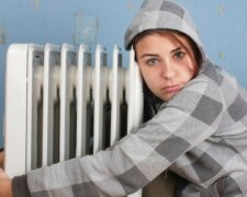 cold-girl-hugging-radiator