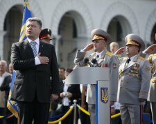 Poroshenko sings a national anthem during the Independence Day military parade, in Kiev