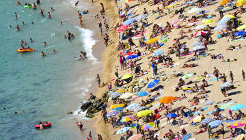Tourists Enjoy Spain’s Costa Brava As The Country Steers Towards A Full-Scale Bailout