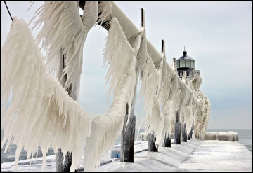 Ice formed on the St. Joseph, Michigan lighthouse and catwalk during a winter storm that churned up Lake Michigan and created 20 foot waves.