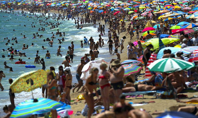 Tourists Enjoy Spain’s Costa Brava As The Country Steers Towards A Full-Scale Bailout