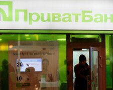 File photo of a man leaving branch of Privatbank in Kiev