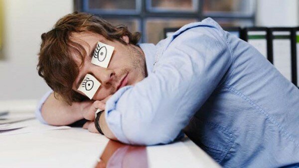 Young Man Sleeping with Drawn on Eyes — Image by © Michael Haegele/Corbis