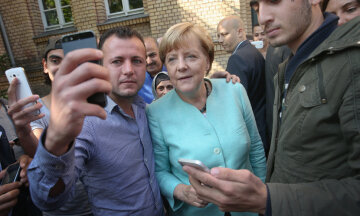 Меркель беженцы