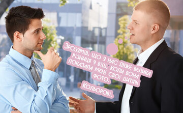 two-men-talking-in-business-suits-gesturing-to-each-other-640×394