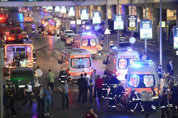 Paramedics help casualties outside Turkey’s largest airport, Istanbul Ataturk, Turkey, followi