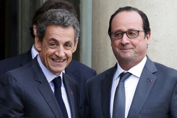 File photo of French President Hollande who stands with Sarkozy, former president and current head o