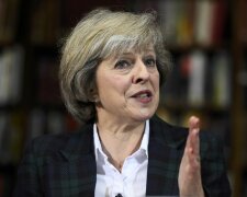 Britain’s Home Secretary Theresa May attends a press conference in London