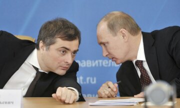 Russian Prime Minister Vladimir Putin (R) talks with Deputy Prime Minister Vladislav Surkov as they attend a meeting on the modernization of regional systems of higher education in the Russian Siberian city of Kurgan in this February 13, 2012 file photo. Surkov, who was once President Putin's chief political strategist and dubbed the Kremlin's puppet master, resigned on May 8, 2013. REUTERS/Alexei Nikolsky/RIA Novosti/Pool/Files (RUSSIA - Tags: EDUCATION POLITICS) THIS IMAGE HAS BEEN SUPPLIED BY A THIRD PARTY. IT IS DISTRIBUTED, EXACTLY AS RECEIVED BY REUTERS, AS A SERVICE TO CLIENTS. FOR EDITORIAL USE ONLY. NOT FOR SALE FOR MARKETING OR ADVERTISING CAMPAIGNS