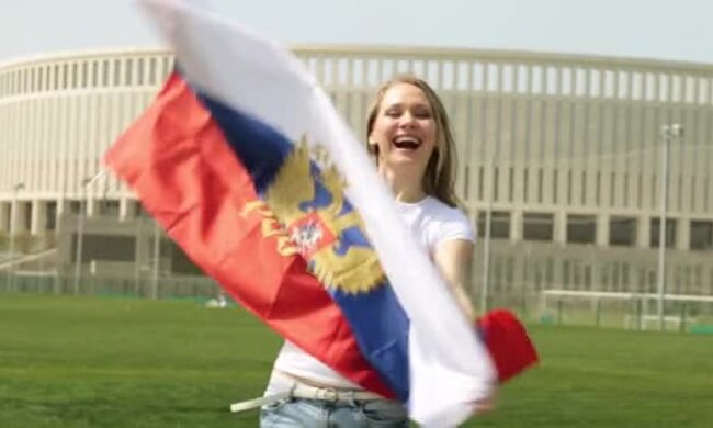 depositphotos_193040692-stock-video-woman-with-the-flag-of