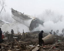 Rescue teams are seen at the crash site of Turkish cargo jet near Kyrgyzstan’s Manas airport o