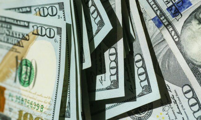долар