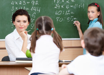 Teacher questions pupils at mathematics