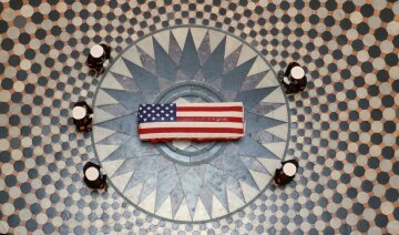 Former astronaut and United States Senator John Glenn lies in state, under a U.S. Marine honor guard, in the Rotunda of the Ohio Statehouse in Columbus, Ohio, U.S., December 16, 2016. NASA/Bill Ingalls/Handout via REUTERS