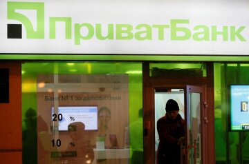 File photo of a man leaving branch of Privatbank in Kiev