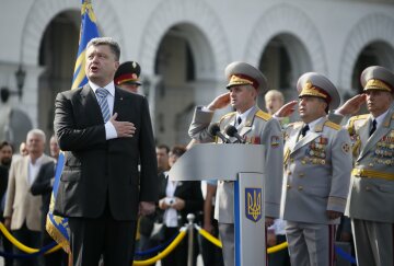 Poroshenko sings a national anthem during the Independence Day military parade, in Kiev