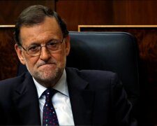 Spain’s acting Prime Minister and People’s Party leader Mariano Rajoy attends an investi