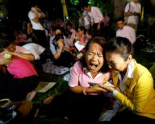 People weep after an announcement that Thailand’s King Bhumibol Adulyadej has died, at the Sir