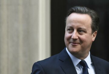 Britain’s Prime Minister David Cameron leaves Number 10 Downing Street to attend Prime Ministe