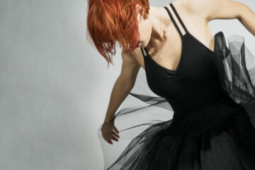 Beautiful ballerina wearing black tutu